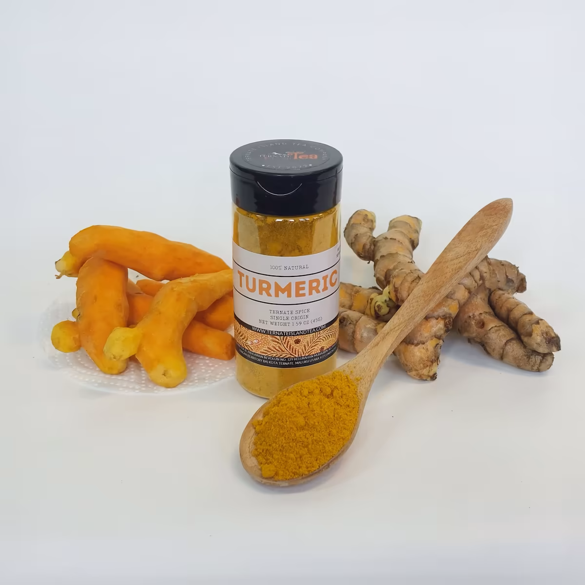 A spice bottle of Turmeric powder with a sleek label reading ‘Ternate Spice, Single Origin,’ displayed on a bed of turmeric powder.