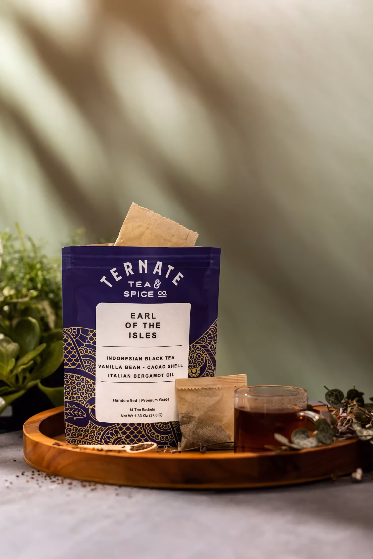 Earl of the Isles black tea packaging with bergamot, vanilla bean, and cacao shell ingredients displayed alongside the tea.